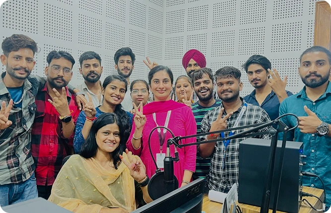 FM GKU 90.4 Team and Students at the Microphone